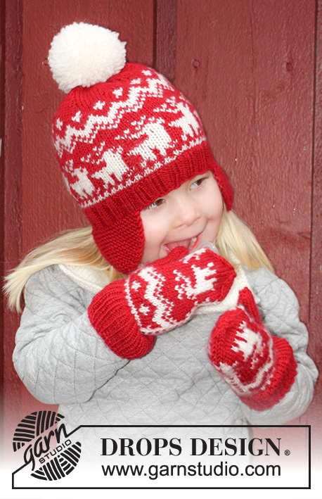 Prancing Around / DROPS Extra 0-1048 - DROPS Christmas: Knitted hat / Santa hat with ear flaps, mittens and neck warmer in DROPS Karisma in Size 3 - 14 years.
