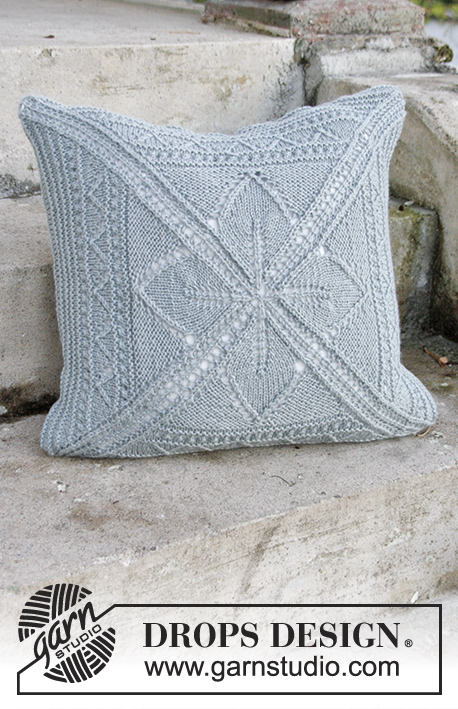 Lucky Charm Pillow / DROPS Extra 0-1314 - Knitted pillow case with lace pattern, worked from the middle and outwards in a square in DROPS Nepal.