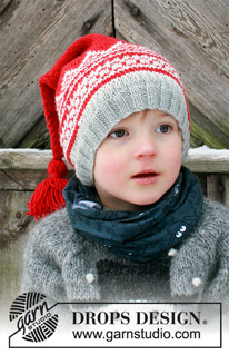 Double Trouble / DROPS Extra 0-1428 - Knitted hat for children in DROPS Merino Extra Fine. The piece is worked with Nordic pattern and tassel. Sizes 2 – 12 years. Theme: Christmas.