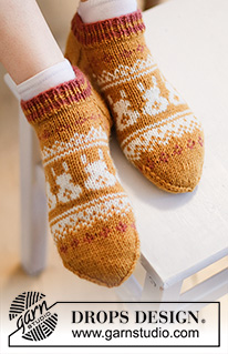 Bunny Steps / DROPS Extra 0-1537 - Ponožky s norským vzorem a velikonočními zajíčky pletené shora dolů z příze DROPS Karisma. Velikost: 35 - 46. Motiv: Velikonoce.