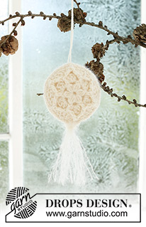 Frozen Flowers / DROPS Extra 0-1589 - Bola de Natal crochetada em DROPS BabyMerino e DROPS Kid-Silk. Crocheta-se em 2 partes, em redondo a partir do meio, em ponto fantasia em relevo, com estrela e borla. Tema: Natal.