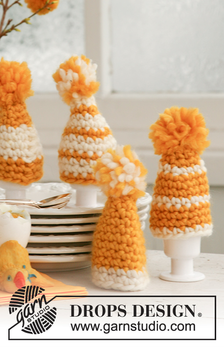 Egg Hats / DROPS Extra 0-505 - Crocheted DROPS easter egg warmer in ”Snow” with pompon.