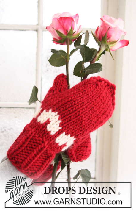 Love Glove / DROPS Extra 0-610 - Gebreide mof of liefdeswant voor dames en heren in DROPS Snow. Het werk wordt gebreid in patroon met hartjes. Maat S - L. Thema: Kerst