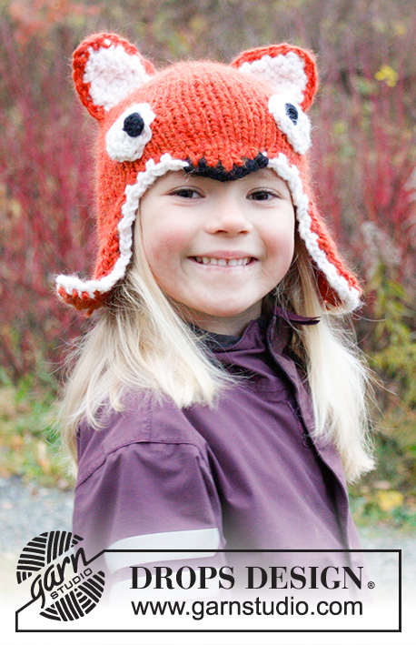 Fawn / DROPS Extra 0-981 - Dziecięca czapka na drutach z włóczki DROPS Andes. Czapka przedstawia lisa, z uszami i brzegiem na szydełku. Rozmiary od 3 - 12 lat.