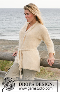 DROPS 100-13 - DROPS cardigan knitted in stocking stitches with crochet details and belt in “Symphony”.