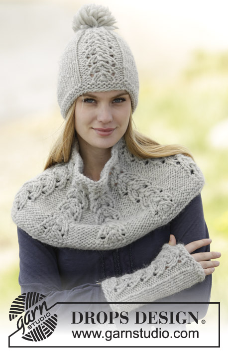 Esmee / DROPS 166-37 - Set consists of: Knitted DROPS hat with pompom, neck warmer and wrist warmers with lace pattern in ”Snow”.