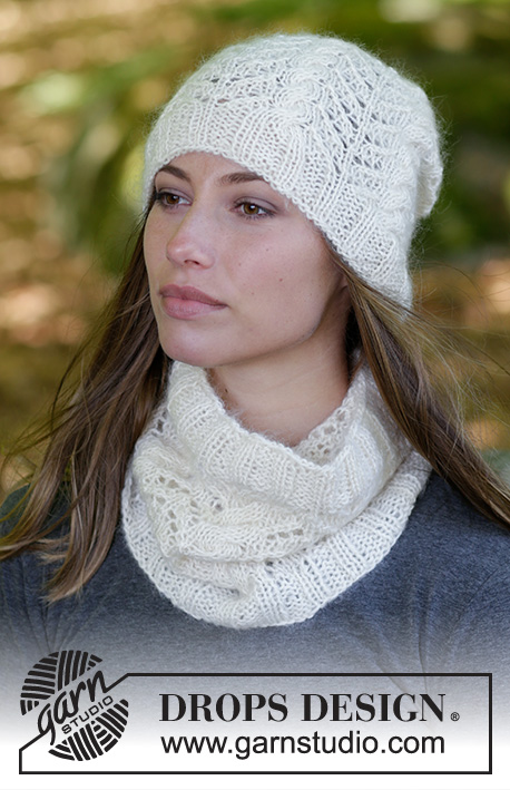 Enrica / DROPS 182-7 - Set consists of: Knitted hat and neck warmer with cables, lace pattern and rib.
Set is worked in DROPS BabyMerino and DROPS Kid-Silk.