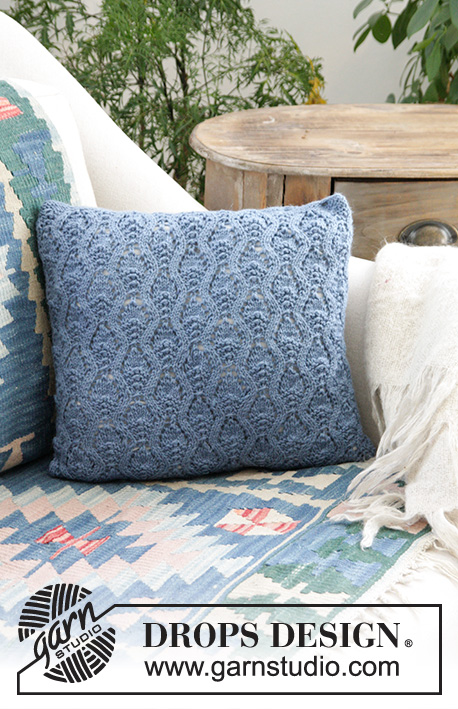 Stay Warm Pillow / DROPS 183-33 - Knitted pillow with lace pattern. The piece is worked in DROPS Lima.
