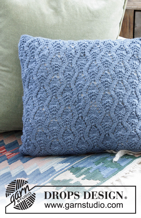 Stay Warm Pillow / DROPS 183-33 - Knitted pillow with lace pattern. The piece is worked in DROPS Lima.