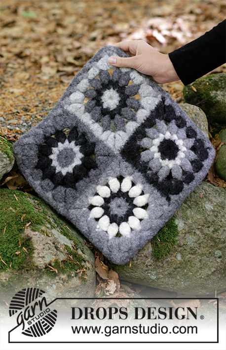 Black Flowers / DROPS 184-36 - Coussin d’assise feutré, composé de carrés au crochet, en DROPS Snow.