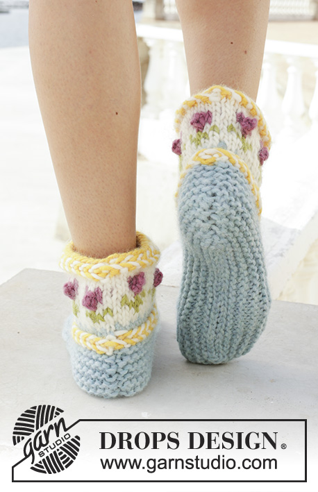 Spring Buds / DROPS 189-34 - Knitted slippers with Latvian cable and multi-colored Nordic pattern. The piece is worked in DROPS Snow.