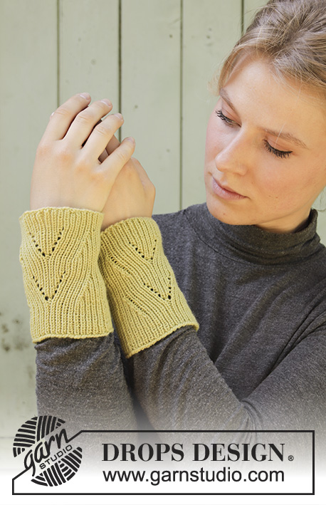 Lime Crush / DROPS 192-63 - Knitted wrist warmers in DROPS BabyMerino. Piece is knitted in the round with lace pattern and rib.