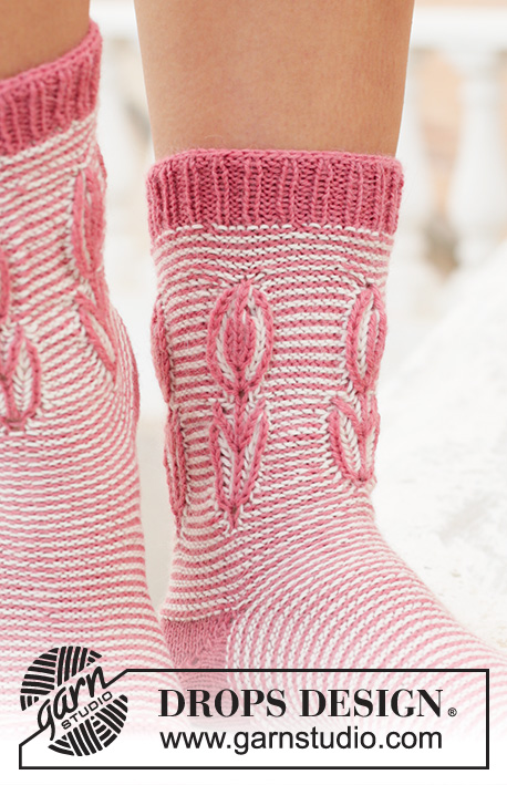 Spring Brings / DROPS 198-15 - Knitted toe-up socks in DROPS Nord. The piece is worked with stripes and 2-colored flower in English rib on the leg. Sizes 35 – 43 = 5 - 10 1/2.