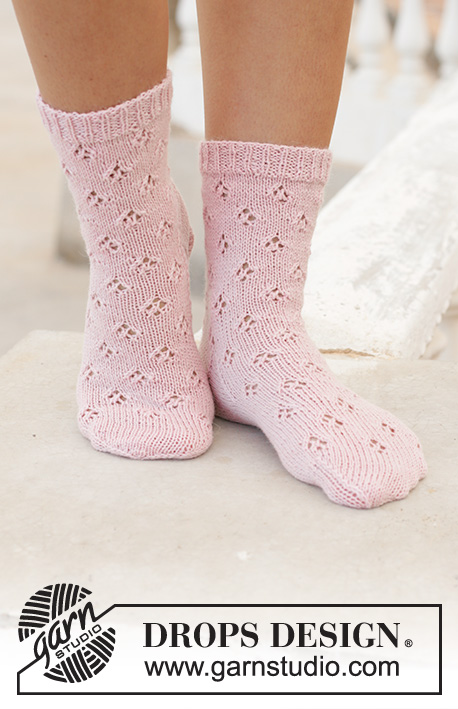 Step into Spring / DROPS 198-18 - Knitted socks in DROPS Nord. Piece is knitted top down with lace pattern. Size 35 to 43