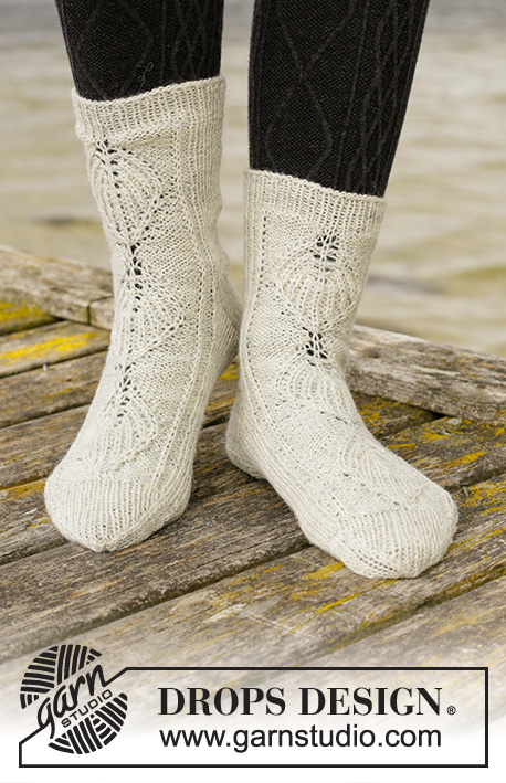 Mermaid Tales / DROPS 203-32 - Knitted socks in DROPS Fabel. The piece is worked top down with leaf pattern in False Fisherman’s rib. Sizes 35 - 43.