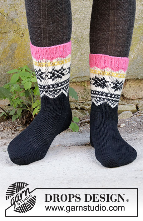 Midnight Snow / DROPS 203-33 - Knitted socks in DROPS Lima. The piece is worked top down with Nordic pattern. Sizes 32-43.