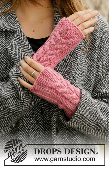 Pink Passion / DROPS 204-25 - Knitted hat and wrist warmers DROPS Merino Extra Fine with rib and cables.