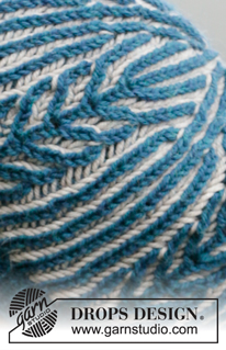 Blue Flake / DROPS 204-27 - Čepice - baret pletený dvoubarevným chytovým patentem z příze DROPS Merino Extra Fine.