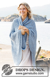 Blue Sea / DROPS 221-1 - Knitted blanket in DROPS Sky with squares and lace pattern.