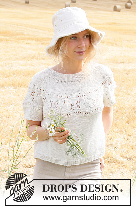 White Moon Top / DROPS 223-13 - Knitted sweater with short sleeves in DROPS Cotton Merino or DROPS Merino Extra Fine. Piece is knitted in stockinette stitch with round yoke, lace pattern on yoke and edges in rib. Size XS–XXL.