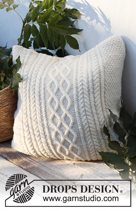 Snowy Trails Pillow / DROPS 228-56 - Knitted cushion-cover with cables and moss stitch in DROPS Karisma.
