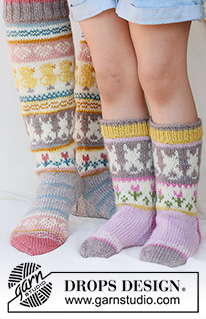 Easter Dance Socks / DROPS 229-35 - Knitted socks in DROPS Karisma. The piece is worked top down in stocking stitch, with multi-coloured pattern and heart, Easter chick, Easter bunny and flower. Sizes 35 - 43. Theme: Easter.