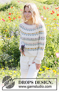 Spring Parade / DROPS 230-8 - Knitted sweater in DROPS Sky. The piece is worked top down with round yoke, flowers/folklore pattern. Sizes S - XXXL.