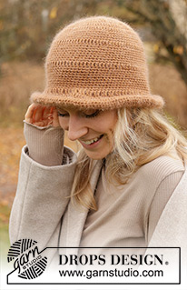 Tree Rings Hat / DROPS 234-81 - Crocheted hat in DROPS Flora and DROPS Kid-Silk. The piece is worked top down with lace pattern and brim. Sizes S - XL.