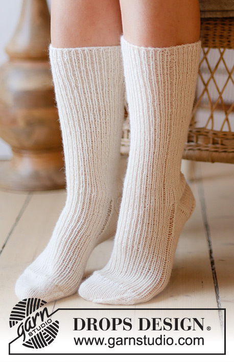 Coconut Cream / DROPS 238-26 - Knitted long socks in DROPS Nord. Piece knitted top down in rib. Size 35 to 43 = US 4 1/2  to 12 1/2