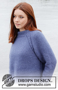 Moonlit Ocean / DROPS 245-13 - Knitted jumper in DROPS Merino Extra Fine and DROPS Kid-Silk. The piece is worked top down with double neck, raglan, cables and split in sides. Sizes S - XXXL.