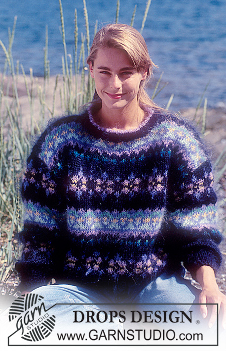 DROPS 28-10 - Sweter na drutach, z żakardem w kwiaty z w włóczki DROPS Vienna.