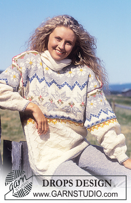 DROPS 31-7 - Sweter na drutach, z włóczki DROPS Alaska, ze ściegiem strukturalnym i z żakardem w kwiaty. W wersji krótkiej lub długiej.