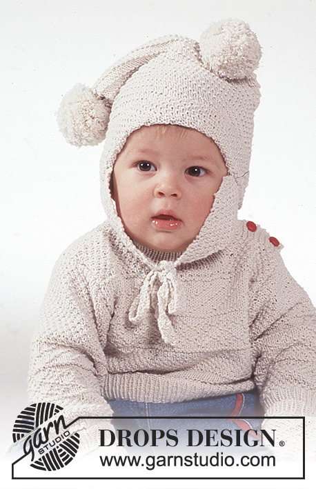 Winter Bunny / DROPS Baby 1-2 - DROPS Aran sweater, hat with pompoms, mittens and socks in Safran