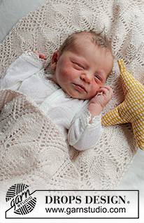 Golden Slumber / DROPS Baby 33-2 - Strikket tæppe til baby i DROPS BabyMerino. Arbejdet er strikket med bladmønster fra midten og ud i en firkant. Tema Babytæppe