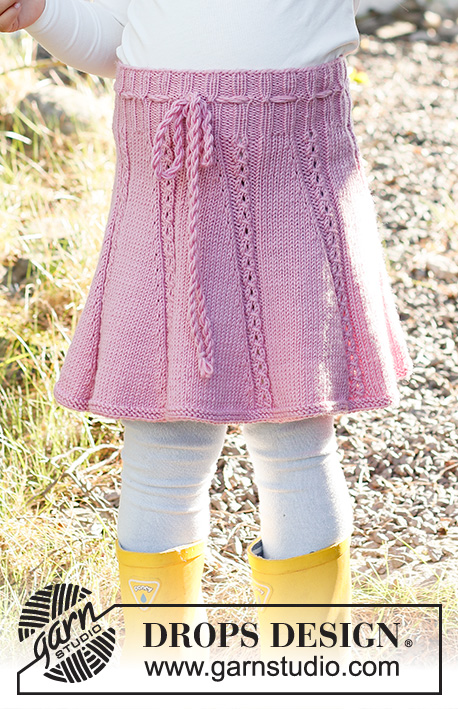 Do the Twist / DROPS Baby & Children 38-14 - Stickad kjol till barn i DROPS Merino Extra Fine. Arbetet stickas uppifrån och ner med hålmönster. Storlek 2 – 12 år.
