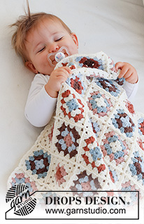 Cuddle Time / DROPS Baby 42-14 - Manta para bebé a ganchillo con cuadrados granny en DROPS Merino Extra Fine.
