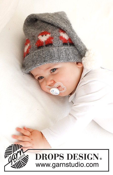 Merry Santas Hat / DROPS Baby 42-22 - Cappello per neonati lavorato ai ferri in DROPS Air. Lavorato con motivo con Babbo Natale e pompom. Taglie: 0 - 2 anni. Tema: Natale.