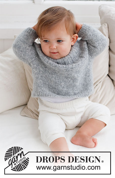 Sweet Gleam / DROPS Baby 43-5 - Strikket bluse til baby i DROPS Sky. Arbejdet strikkes oppefra og ned med rundt bærestykke og rib på bærestykket. Størrelse Præmatur til 2 år.