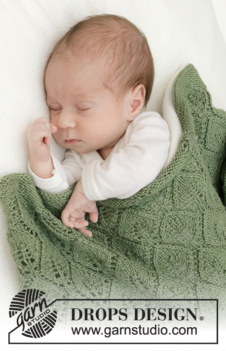 Endless Evergreen Blanket / DROPS Baby 46-13 - Tasona neulottu vauvanpeitto DROPS Baby Merino -langasta. Työssä on pitsineuletta.