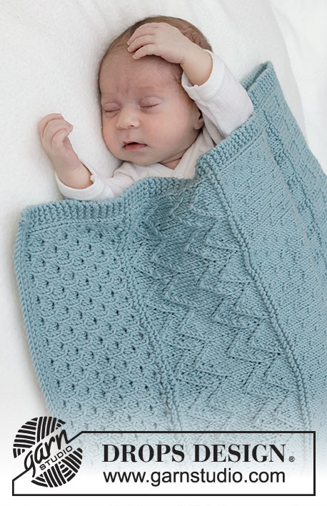 Dot Dot Line Blanket / DROPS Baby 46-3 - Couverture tricotée pour bébé en DROPS Merino Extra Fine. Se tricote en allers et retours avec point relief.