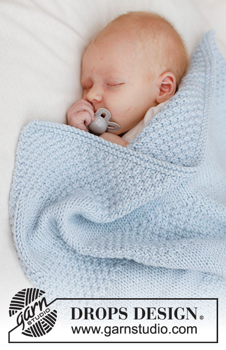 Treasured Pearl Blanket / DROPS Baby 46-5 - Tasona neulottu vauvanpeitto DROPS Big Merino -langasta. Työssä on sileää neuletta, helmineuletta ja raitoja.