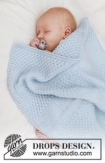 Treasured Pearl Blanket / DROPS Baby 46-5 - Tasona neulottu vauvanpeitto DROPS Big Merino -langasta. Työssä on sileää neuletta, helmineuletta ja raitoja.