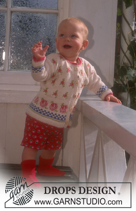 DROPS Baby 6-22 - Cardigan et chaussettes DROPS en Safran, avec motif roses