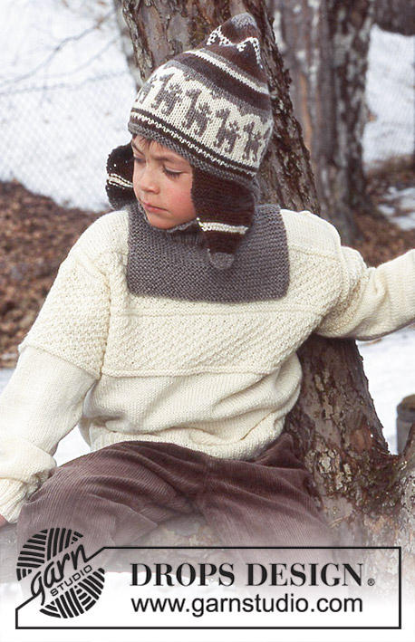 DROPS Children 12-40 - Strikket sett med genser, lue og hals til barn i DROPS Karisma. Arbeidet strikkes med strukturmønster, riller og flerfarget mønster. Størrelse 3 - 14 år.
