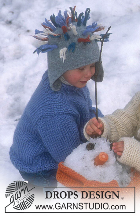 DROPS Children 12-47 - Gestrickte und gefilzte Mütze mit Zöpfen oder Fransen in DROPS Alaska und DROPS Snow.