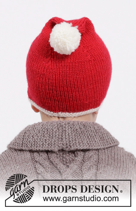 Charming Cooper Santa Hat / DROPS Children 26-18 - Set of knitted christmas hat with pompom and bow in DROPS Karisma or DROPS Lima. Size children 6 months - 12 years.