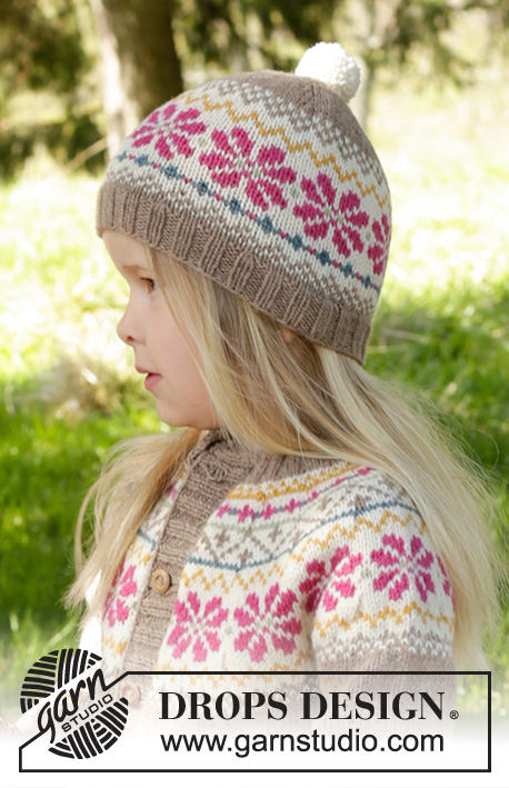 Prairie Fairy Hat / DROPS Children 27-6 - Gebreide muts met Scandinavisch patroon en pompons in DROPS Lima. Maat kinderen 3 - 12 jaar.