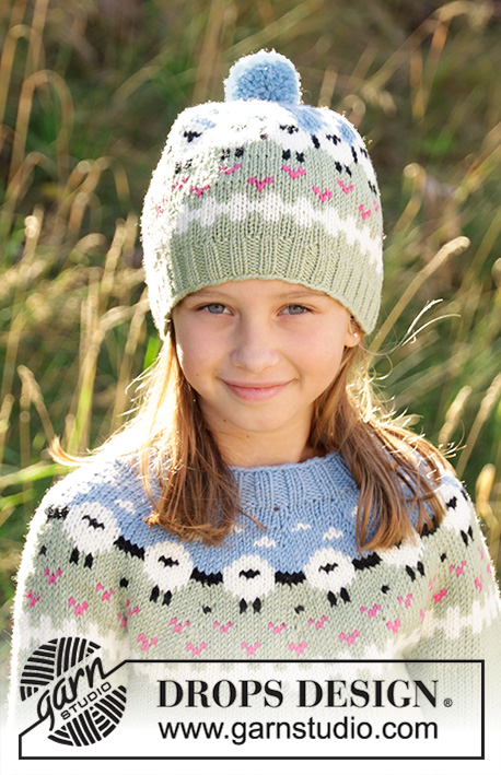 Lamb Dance Hat / DROPS Children 34-2 - Knitted hat for kids in DROPS Merino Extra Fine or DROPS Lima.
Piece is knitted bottom up with sheeps, color pattern, rib and pompom. Size 3-12 years