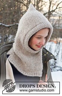 Warm Snuggles Kids / DROPS Children 37-27 - Bonnet / cagoule tricotée pour enfant en DROPS Karisma et DROPS Brushed Alpaca Silk. Se tricote entièrement en jersey, avec une bordure en côtes. Du 12/18 mois au 12 ans.
