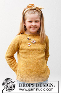 Bee Season Jumper / DROPS Children 40-1 - Stickad tröja till barn i DROPS Soft Tweed. Arbetet stickas uppifrån och ner med raglan, och med broderade blommor och bin. Storlek 3-14 år.